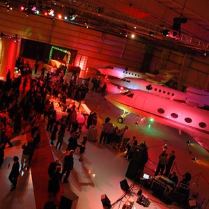 DesignLight designs holiday event, airplane hanger